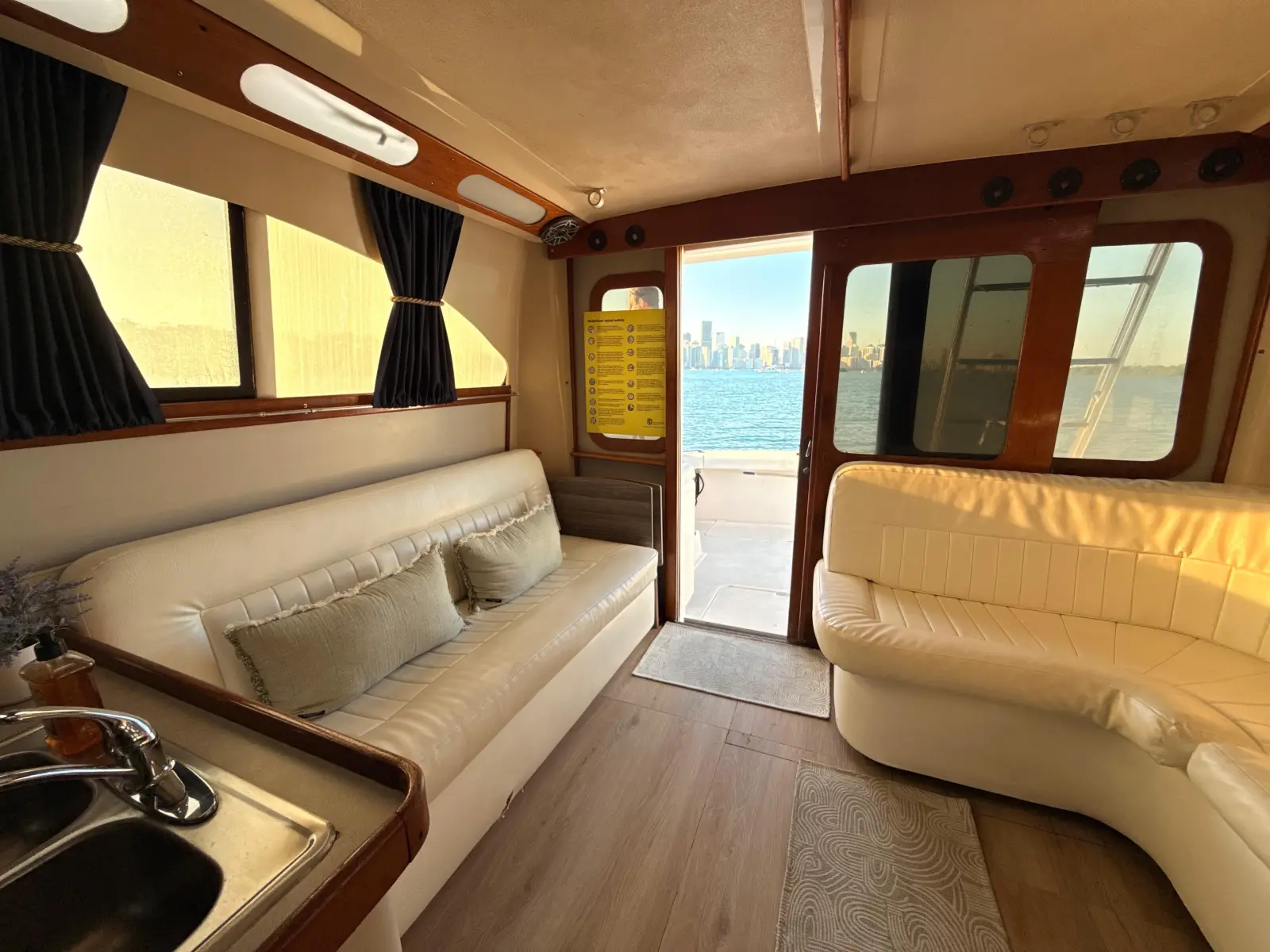 The Luhrs cabin with the aft door open to the Miami skyline