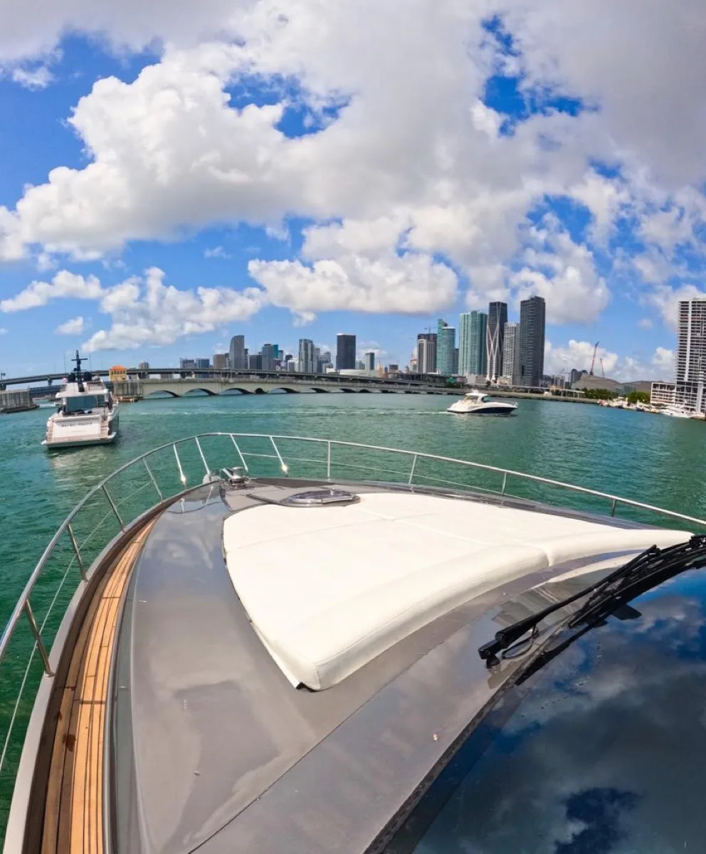 The foredeck sunpad of the Pershing with the Miami skyline behind